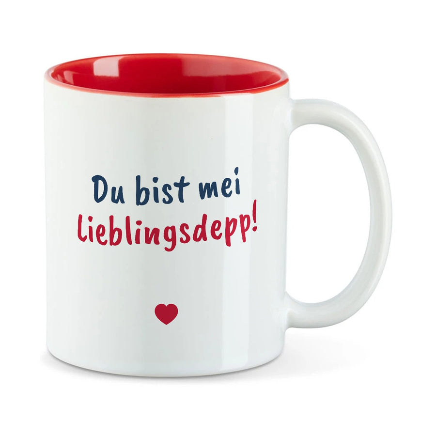 Weiße Tasse mit roter Innenseite und dem bairischen Spruch „Du bist mei Lieblingsdepp!“ in Pinselschrift.