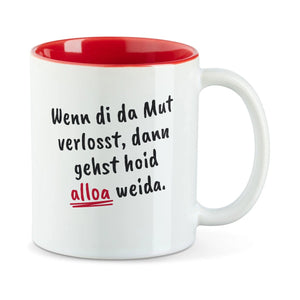 Weiße Tasse mit roter Innenseite und dem bairischen Spruch „Wenn di da Mut verlosst, dann gehst hoid alloa weida.“ in Pinselschrift.