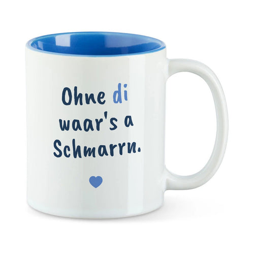 Weiße Tasse mit blauer Innenseite und dem bairischen Spruch „Ohne di waar's a Schmarrn.“ in Pinselschrift.